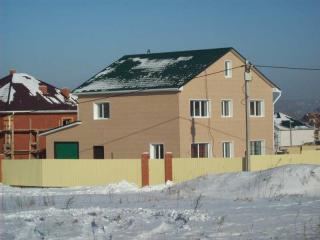 Архитектурный проект одноквартирного жилого дома с гаражом, построенного в городе Хабаровске